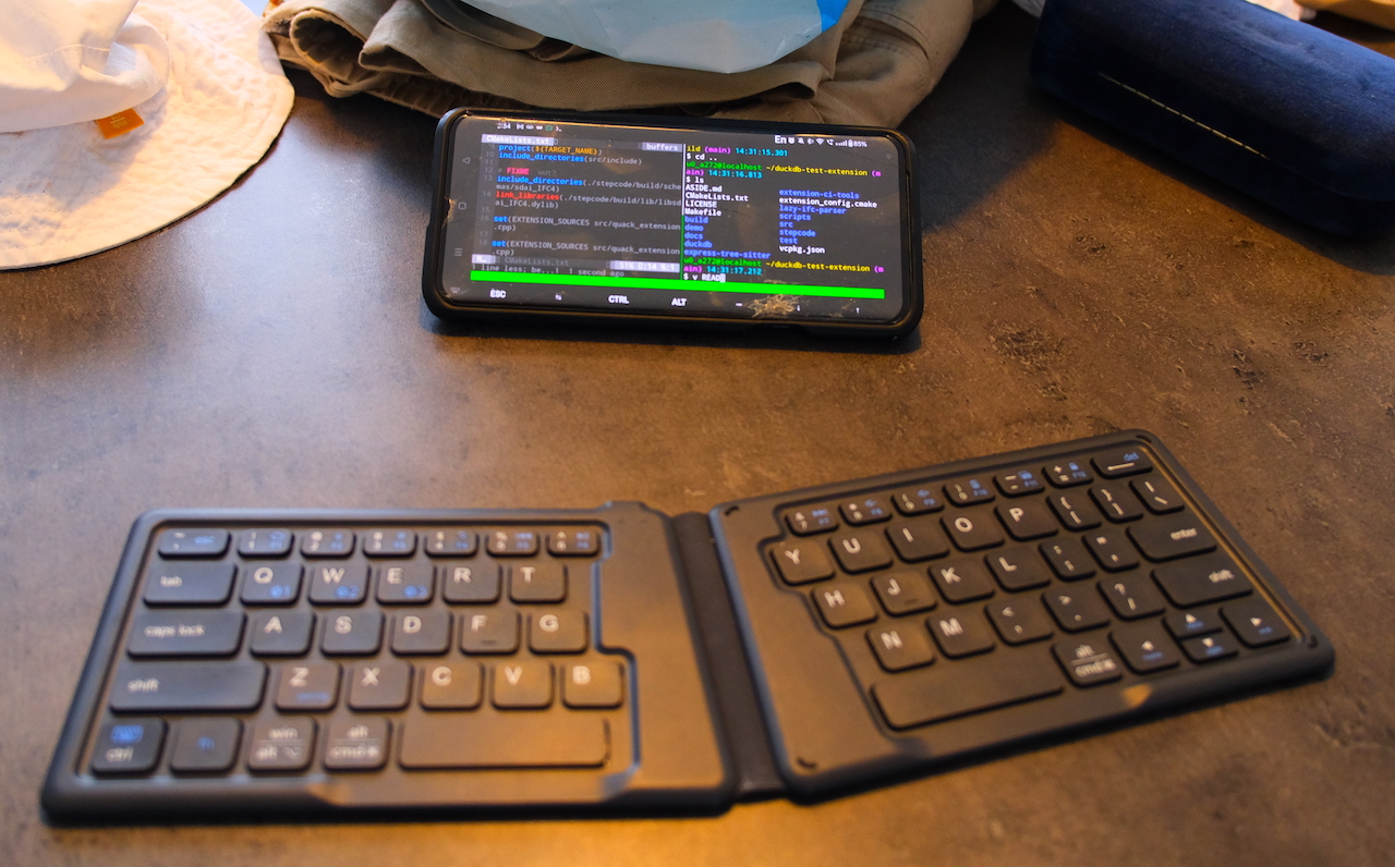 a picture of my phone kickstanded and my bluetooth keyboard in front of it